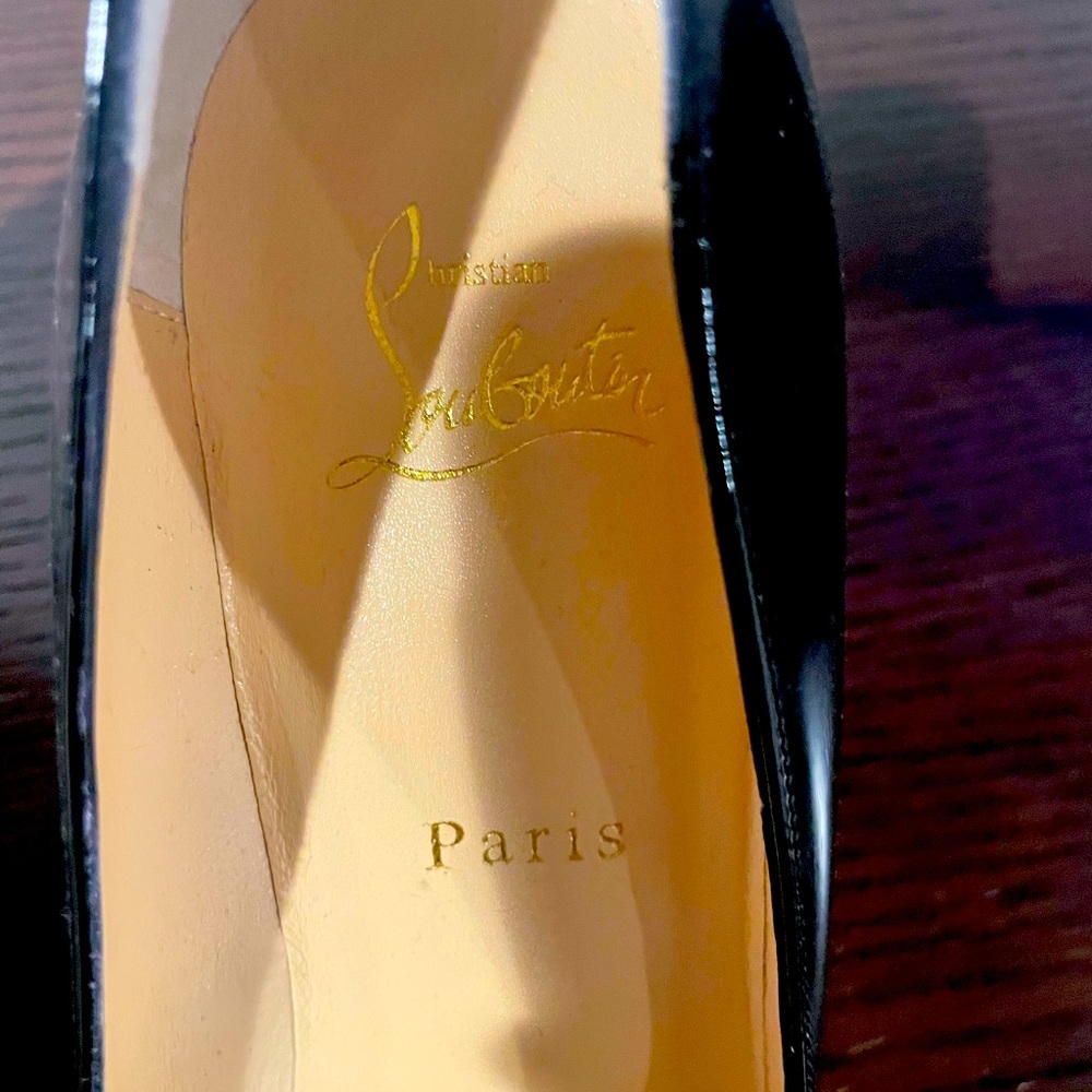 Christian Louboutin Red bottom black heels. 39 1/2 size. Never worn. No box